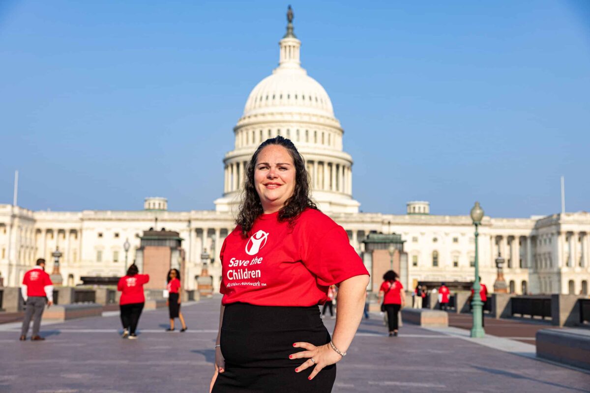 SCAN advocate standing in front of Capitol Hill in Washington, D.C. as they attend the 2023 Advocacy Summit.